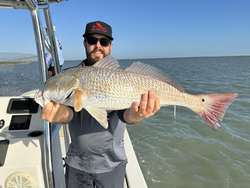 Nice redfish using jigging and trolling techniques in Port O'Connor!
