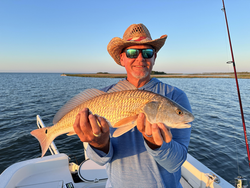 Nice redfish caught trolling with light tackle in Port O'Connor! Perfect clear conditions for an exciting adventure.