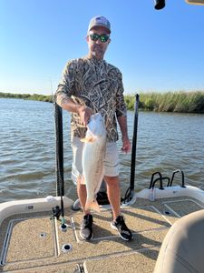One fisherman catching fish in Cocodrie