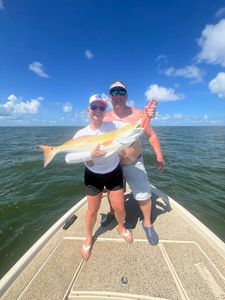 Two people fishing in Cocodrie