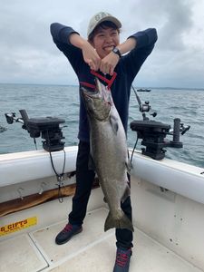 A fisherman catches a sea trout in NY