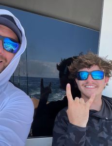 Two people enjoying a Charleston cruise and fishing adventure