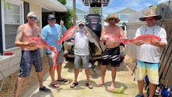 4 fishing rod tips and Jacksonville Beach in the background