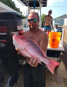A group of 3 people fishing in FL