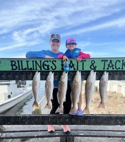 Anglers holding fishing rods in Corpus Christi