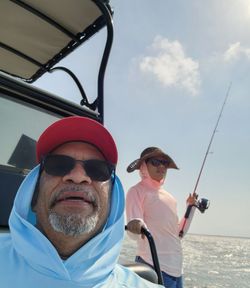 Two people enjoying a fishing trip in Corpus Christi