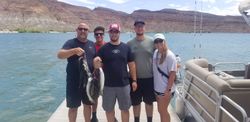 Five people fishing on the water in UT