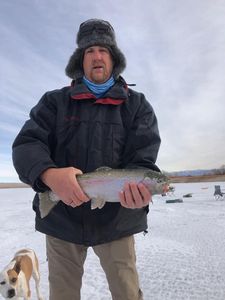 Angler with a 14-inch rainbow trout in Utah