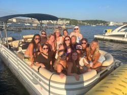 Smiling group of 14 people enjoying fishing tours in Osage Beach