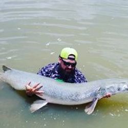 Angler with a 43-inch fish in Cayuga