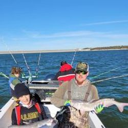 Angler fishing on the shore of Cayuga Lake