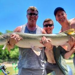 Three people fishing at Cayuga lake