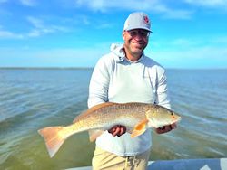 One angler holding a large fish in Port Aransas
