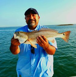 Angler holding a 20-inch fish in Port Aransas