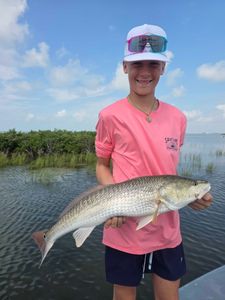 Angler with a big redfish caught in TX