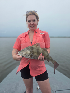 Reeling in a 16-inch Black Drum on a stormy day at Conn Brown Harbor!