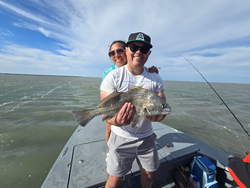 Hooked a feisty Black Drum while casting and jigging my way to a great day of fishing in Port Aransas, TX!