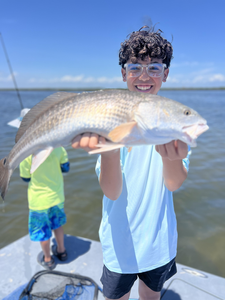Drifting through Conn Brown Harbor with light tackle under scattered clouds!