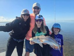 A day of family fun and fishing on the water, capturing cherished moments and the thrill of the catch.