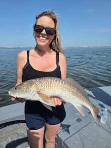 One person fishing with a pole in TX
