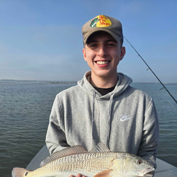 "Peaceful day of fishing by the serene lake."