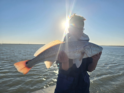 "Serene Fishing Moment: A peaceful day spent angling on the tranquil waters."