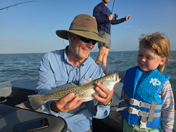 A 21-inch spotted weakfish landed with the light tackle drift fishing method.
