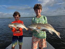 Two people fishing in TX