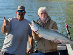 Two people fishing for a Chinook Salmon at Granite Bay