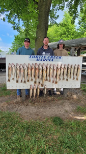 Three people enjoying a fishing trip at Lakeside Marblehead