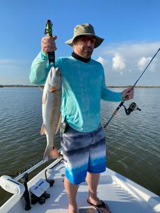 Angler holding a 22-inch fish in League City