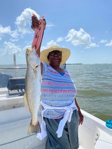 Angler holding a 26-inch fish in League City