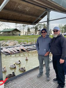 Two people enjoying a fishing trip in League City
