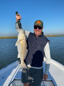 A lone angler with a big catch in League City