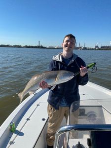A person fishing in League City
