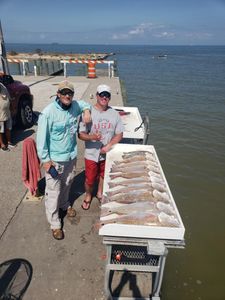 Two people fishing in TX