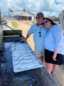 Two people enjoying a fishing trip in League City