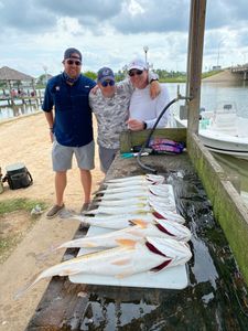 A group of 3 people fishing in League City, Texas