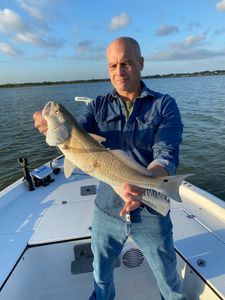 A lone fisherman in League City enjoys a great day of fishing.