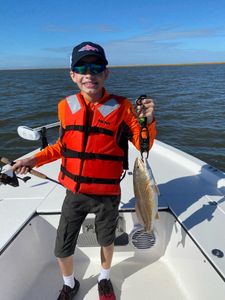 A person catching a redfish in League City