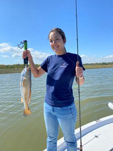 Angler with a 14-inch fish caught in TX
