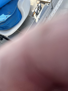 Fishing boat deck with equipment and blurred motion effect on water