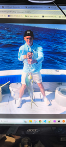 Fresh caught fish displayed on fishing boat deck over blue ocean water