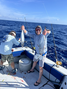 Fishing boat on ocean with freshly caught Little Tunny being displayed