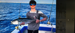 Little tunny caught during fishing trip on boat in open water