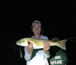 Nothing beats the thrill of landing a redfish under the stars!