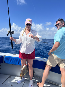 Successful fishing trip on boat with caught fish displayed on deck