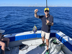 Successful fishing trip showing caught fish on boat deck in open ocean waters