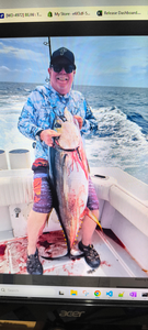 Yellowfin tuna caught while fishing on boat in ocean