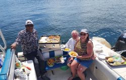 Three people enjoying a great day of fishing and water sports in FL
